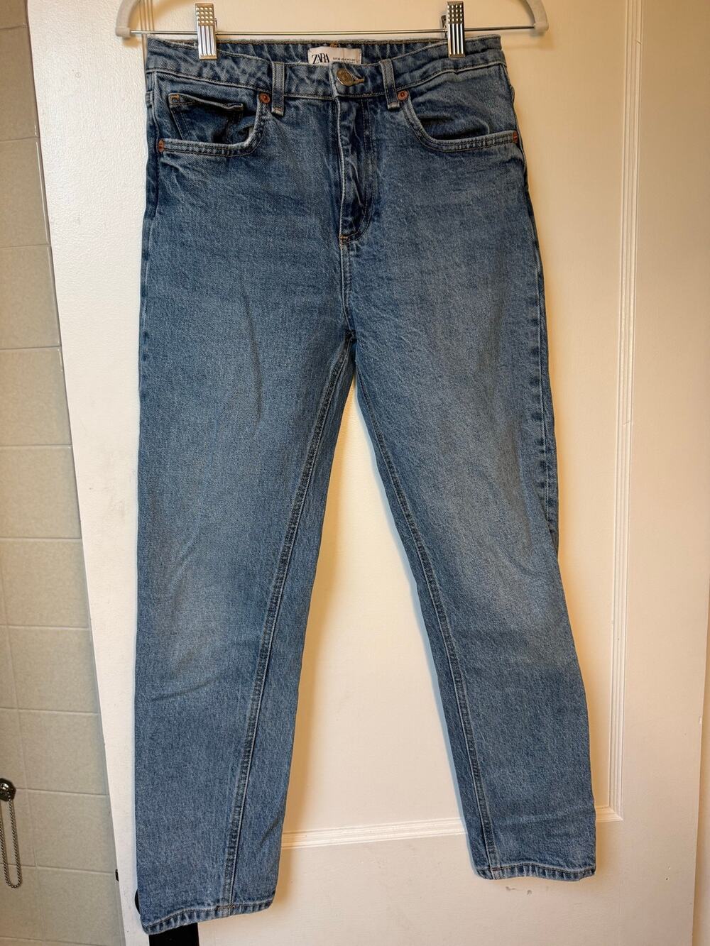 Medium-wash blue Zara high-rise mom fit denim jeans